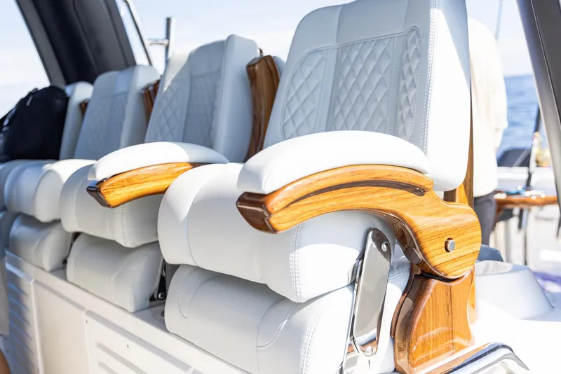 Slide: The Image of Luxurious seating on 2024 Aquila 47 Molokai yacht with elegant wood accents. - 13