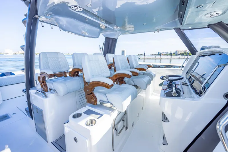 Slide: The Image of Luxurious 2024 Aquila 47 Molokai yacht interior with plush seating and modern helm. - 14