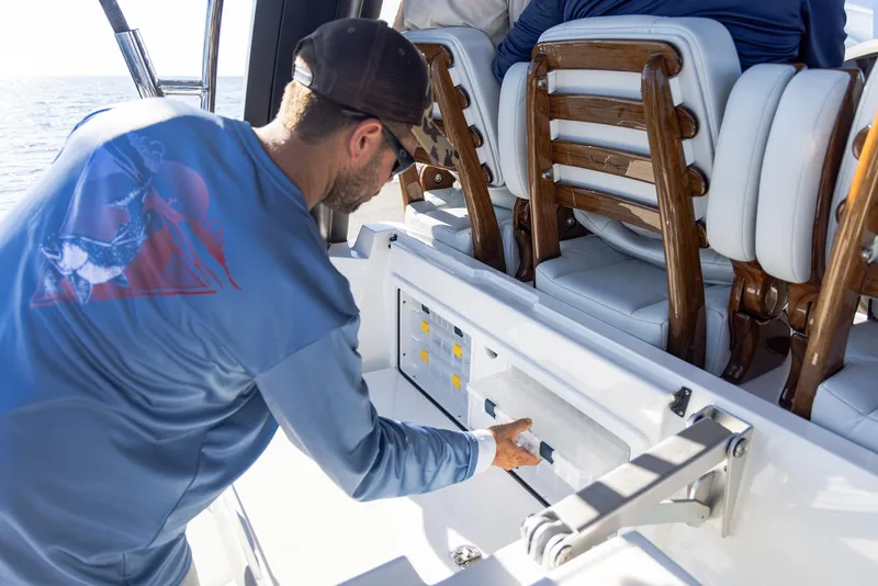 Slide: The Image of Man operating controls on 2024 Aquila 47 Molokai boat deck. - 20