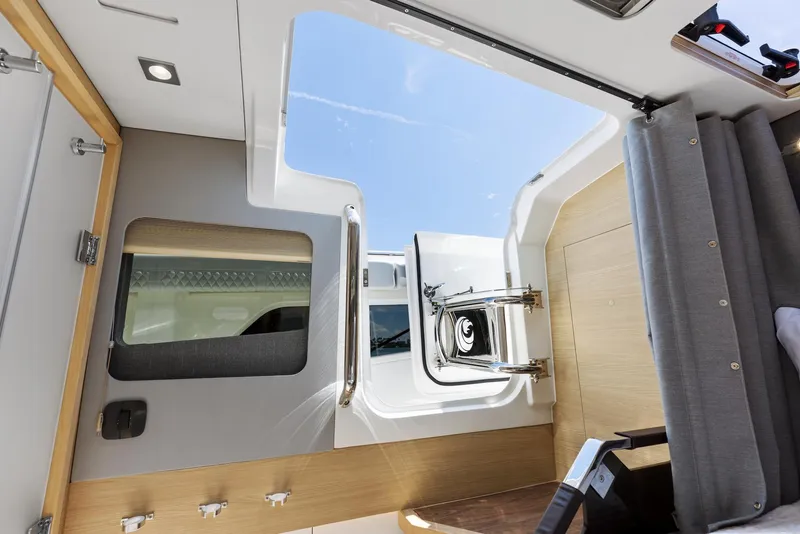 Slide: The Image of Interior view of 2024 Aquila 47 Molokai yacht with open hatch and modern design. - 29
