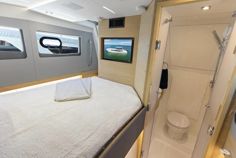 Slide: The Image of Interior of 2024 Aquila 47 Molokai yacht with bed and bathroom. - 31