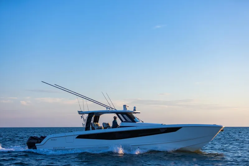 Slide: The Image of 2024 Aquila 47 Molokai cruising on open water at sunset. - 7