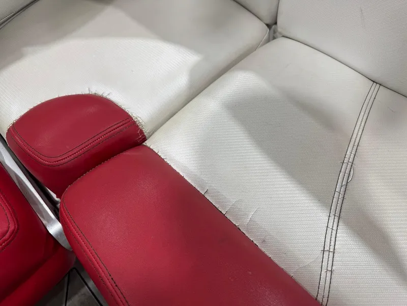Slide: The Image of Red and white leather seats in a 2013 MasterCraft X30 boat. - 15