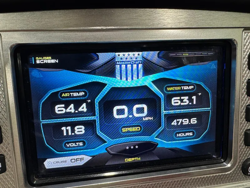 Slide: The Image of 2013 MasterCraft X30 dashboard display showing air and water temperature, speed, and engine hours. - 24