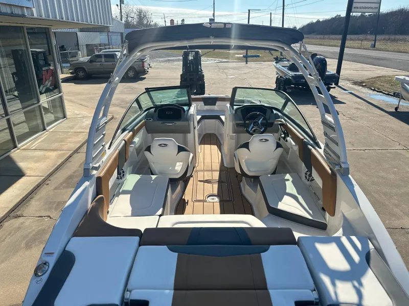 Slide: The Image of 2025 Chaparral 23 SSi boat interior with modern seating and dashboard. - 4