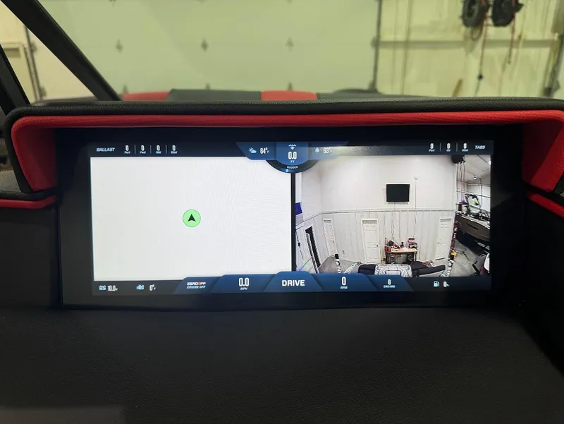 Slide: The Image of 2025 MasterCraft X24 dashboard display with navigation and camera view. - 19