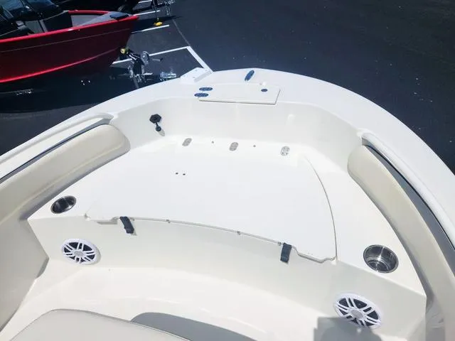 Slide: The Image of 2023 Stingray 173 CC boat interior with seating, cup holders, and speakers. - 11