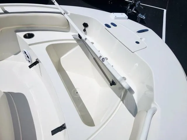 Slide: The Image of 2023 Stingray 173 CC boat interior with seating and storage compartments. - 12