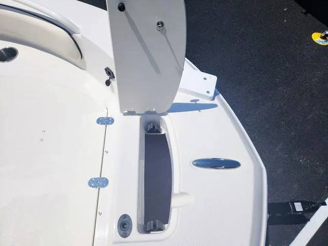 Slide: The Image of 2023 Stingray 173 CC boat deck with open storage compartment. - 13