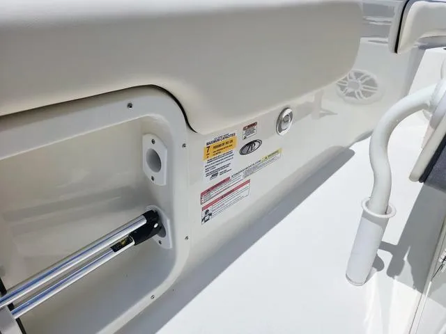 Slide: The Image of 2023 Stingray 173 CC boat interior with safety labels and stainless steel fittings. - 27