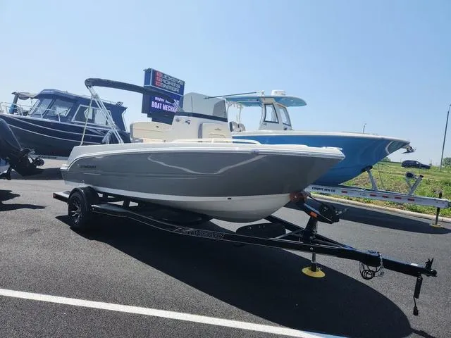 Slide: The Image of 2023 Stingray 173 CC boat on trailer in parking lot, sunny day. - 3