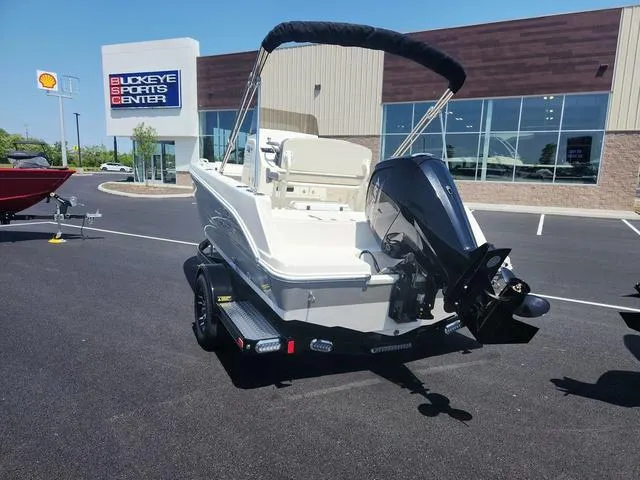Slide: The Image of 2023 Stingray 173 CC boat displayed at Buckeye Sports Center parking lot. - 6