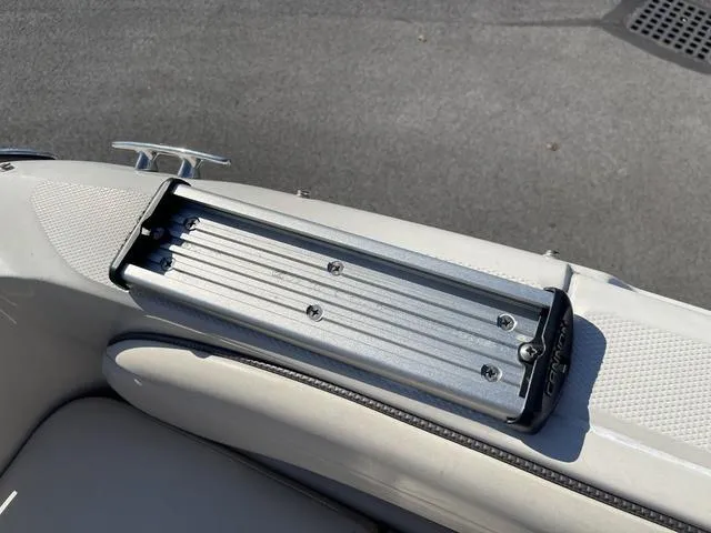 Slide: The Image of 2005 Sea Ray 225 Weekender boat detail, featuring a mounted accessory track. - 11