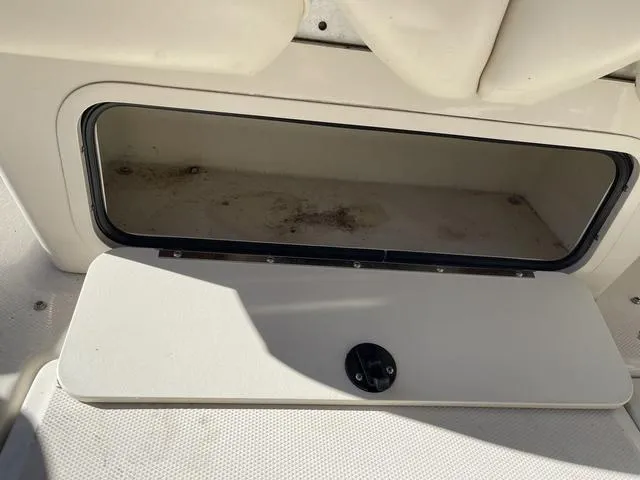 Slide: The Image of Open storage compartment on 2005 Sea Ray 225 Weekender boat. - 18