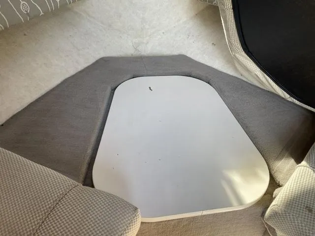 Slide: The Image of Interior cabin of 2005 Sea Ray 225 Weekender boat with cushioned seating. - 23