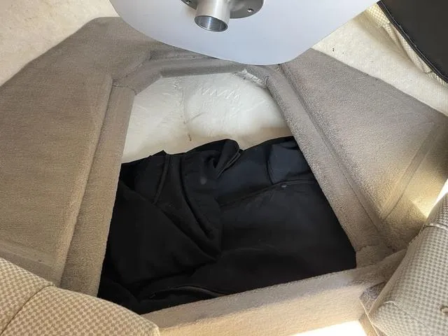 Slide: The Image of Interior cabin of 2005 Sea Ray 225 Weekender boat with seating and storage. - 24