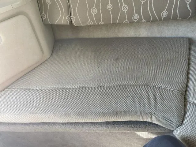 Slide: The Image of Interior seating of 2005 Sea Ray 225 Weekender boat, featuring patterned upholstery. - 28