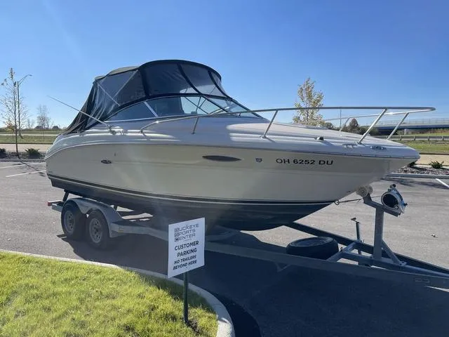 Slide: The Image of 2005 Sea Ray 225 Weekender boat on trailer in parking lot. - 3