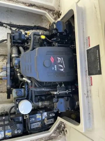 Slide: The Image of 2005 Sea Ray 225 Weekender engine compartment with MerCruiser 5.0 MPI motor. - 30