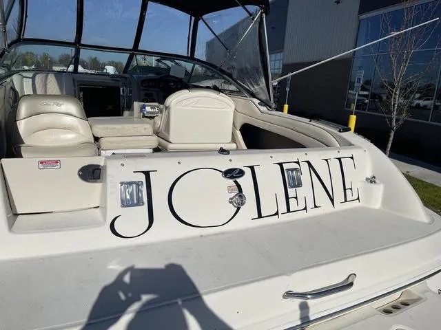 Slide: The Image of 2005 Sea Ray 225 Weekender boat named "Jolene" docked outdoors. - 31