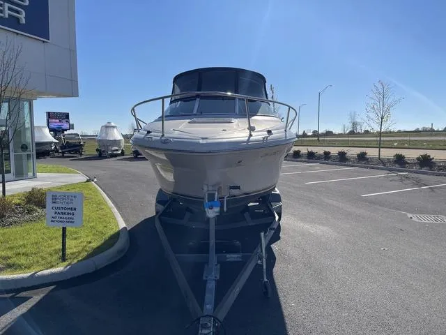 Slide: The Image of 2005 Sea Ray 225 Weekender boat on trailer in parking lot. - 7