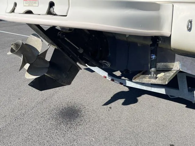 Slide: The Image of 2005 Sea Ray 225 Weekender boat propeller and stern detail on pavement. - 9