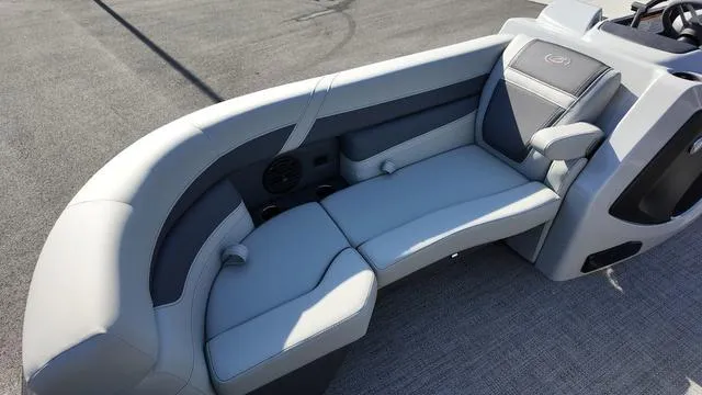 Slide: The Image of 2024 Barletta Cabrio C24UE boat interior seating, featuring sleek gray upholstery. - 11
