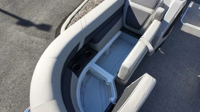 Slide: The Image of 2024 Barletta Cabrio C24UE boat seating with storage and cup holders. - 12