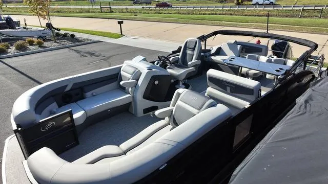 Slide: The Image of 2024 Barletta Cabrio C24UE pontoon boat with spacious seating and modern design. - 9