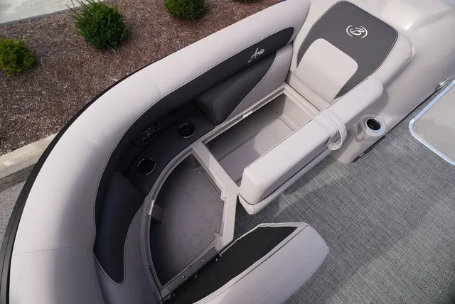 Slide: The Image of The image shows the seating area of a Barletta Aria A22CC boat with gray upholstery and cup holders. - 41
