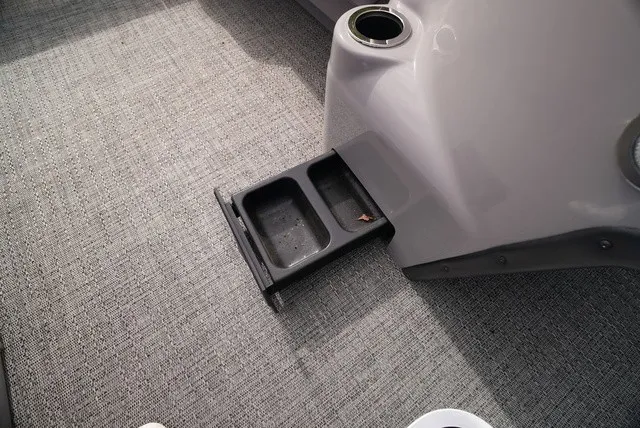 Slide: The Image of A gray floor with a pull-out cup holder in a boat. - 35