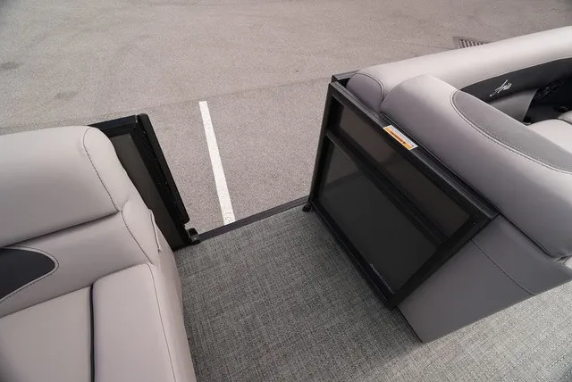 Slide: The Image of The image shows the interior of a Barletta Aria A22CC boat with gray upholstery and carpet flooring. - 26