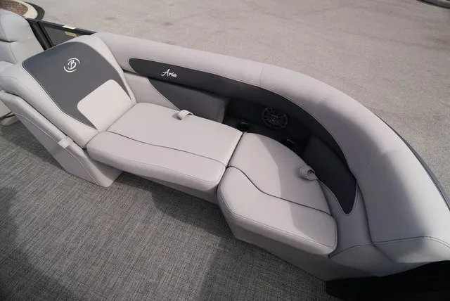 Slide: The Image of The image shows a sleek, gray seating area on a boat with the Barletta Boats logo. - 38