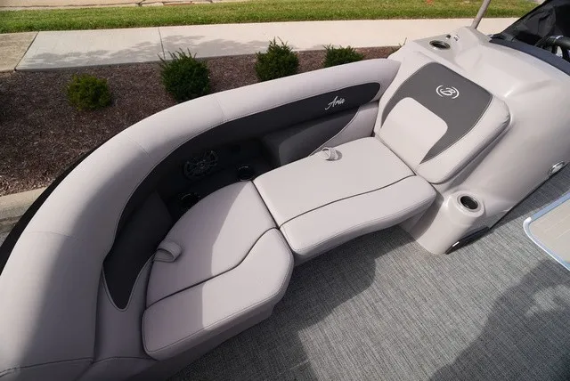 Slide: The Image of The image shows an elegant gray seating area on a boat with cushioned seats and cup holders. - 40