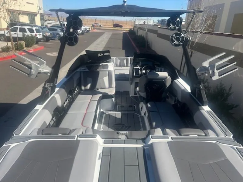Slide: The Image of 2021 Malibu 23 MXZ boat interior with spacious seating and modern design. - 10