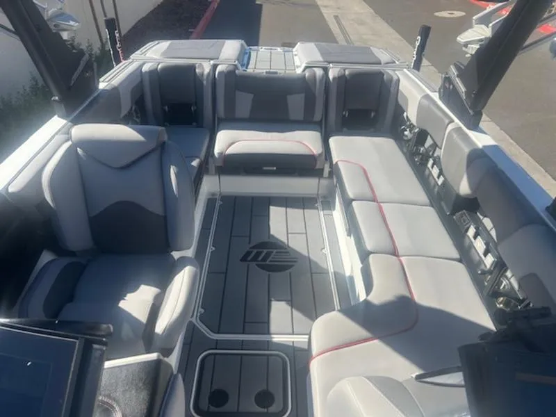 Slide: The Image of 2021 Malibu 23 MXZ boat interior with spacious seating and modern design. - 15
