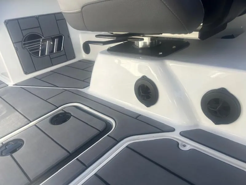 Slide: The Image of 2021 Malibu 23 MXZ boat interior with sleek seating and modern design. - 16