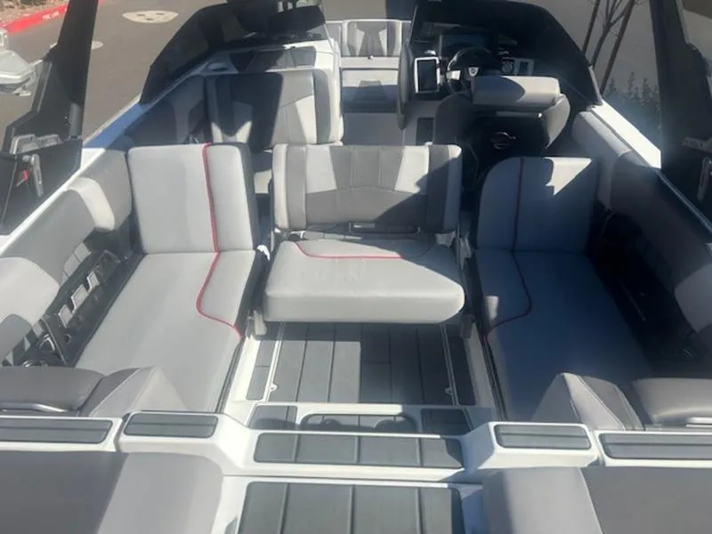 Slide: The Image of 2021 Malibu 23 MXZ boat interior with spacious seating and modern design. - 17