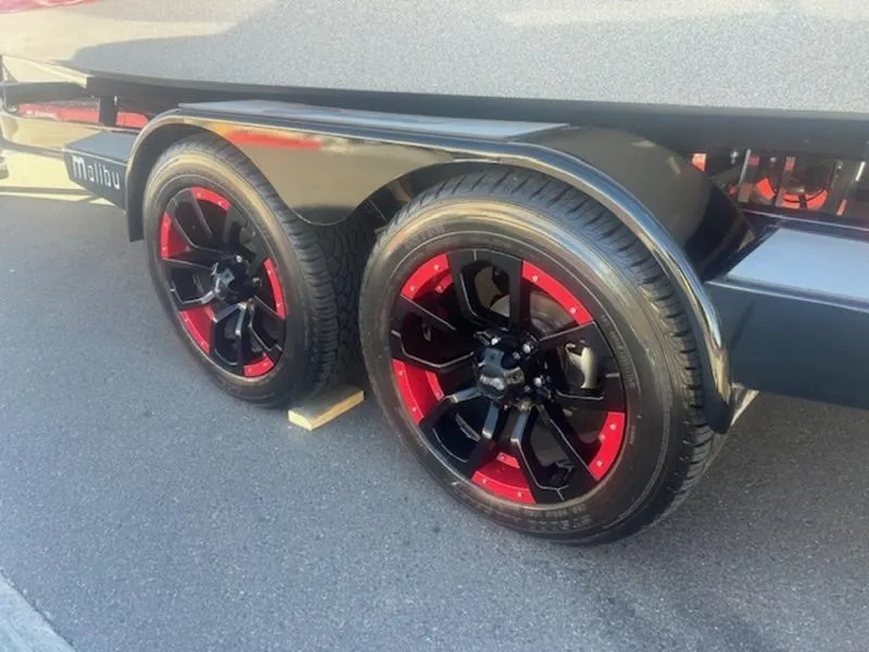 Slide: The Image of 2021 Malibu 23 MXZ trailer with stylish black and red wheels. - 9