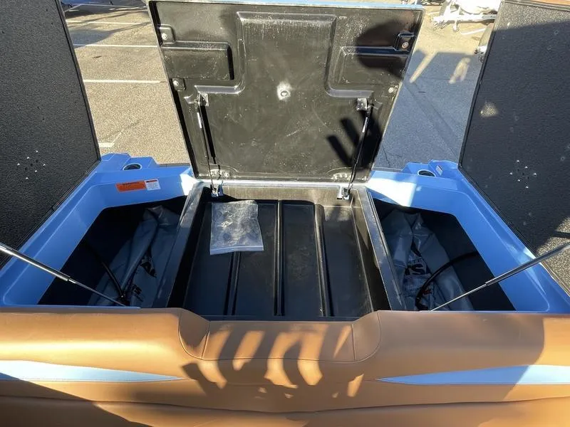 Slide: The Image of Open storage compartment of 2024 Axis A245 boat, showcasing interior space. - 17