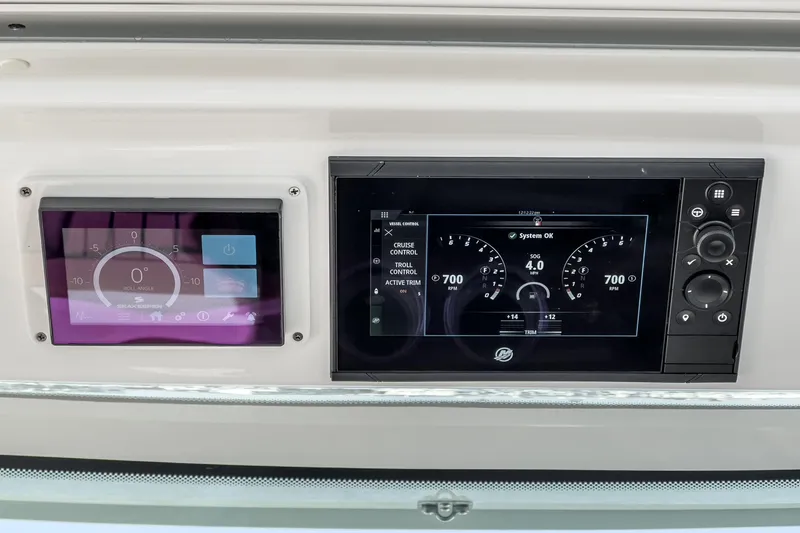 Slide: The Image of Dashboard of 2023 Tiara Yachts 43 LS with digital displays and controls. - 28