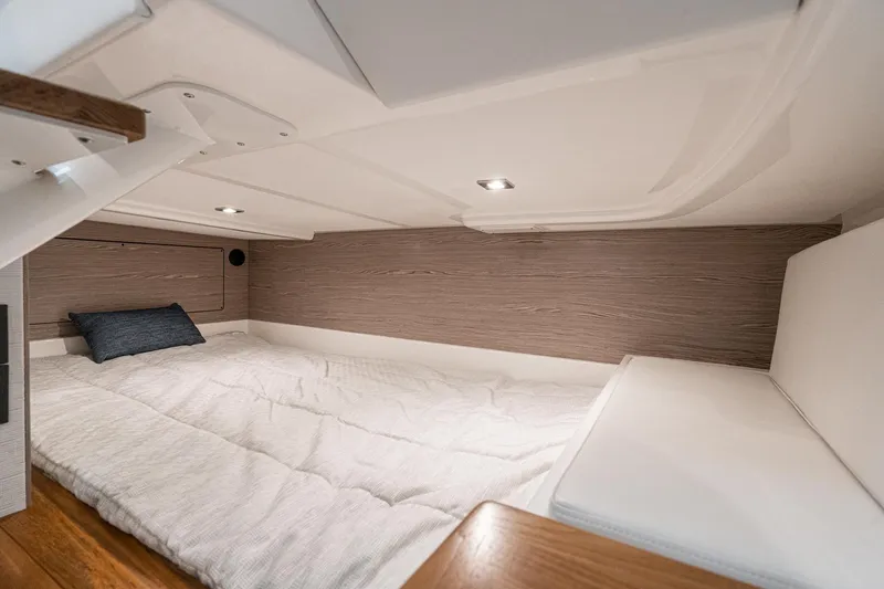 Slide: The Image of Luxurious cabin interior of 2023 Tiara Yachts 43 LS with cozy bedding. - 35