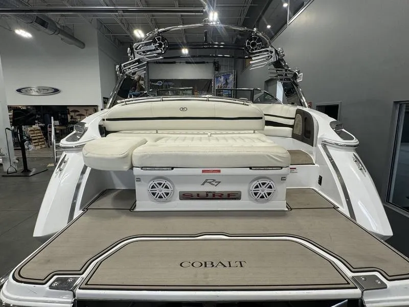 Slide: The Image of 2017 Cobalt R7WSS Surf boat with spacious deck and seating in showroom. - 5