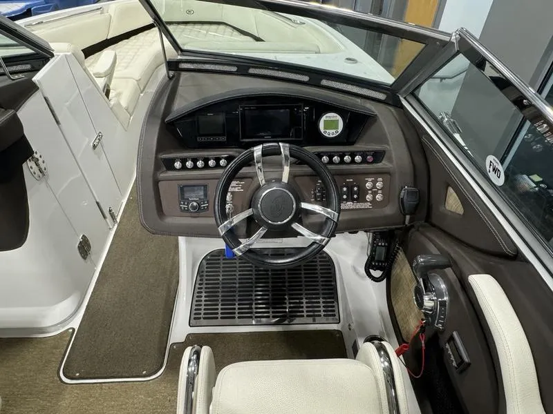 Slide: The Image of 2017 Cobalt R7WSS Surf boat dashboard with steering wheel and control panel. - 7