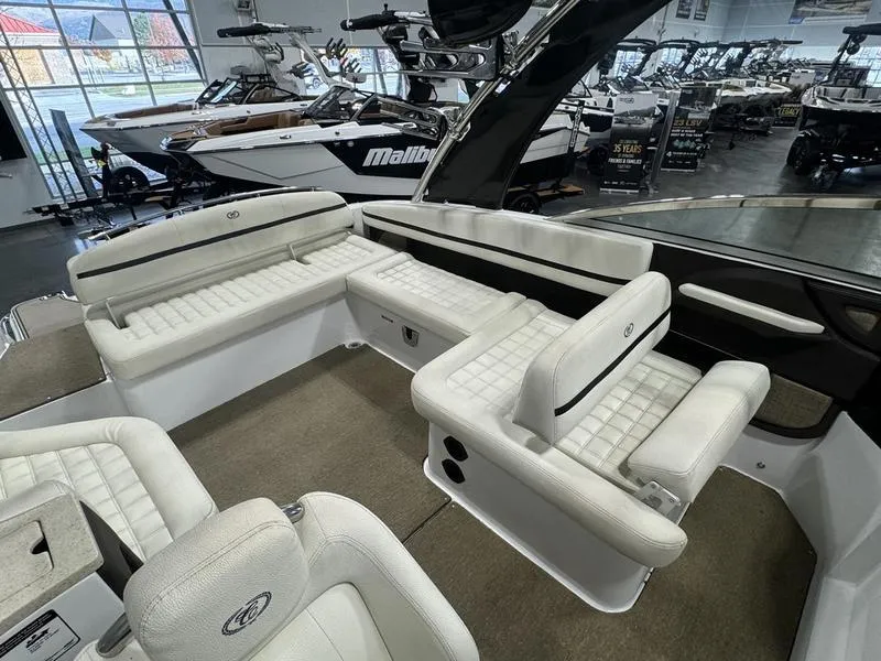 Slide: The Image of 2017 Cobalt R7WSS Surf boat interior with white seating in showroom. - 9