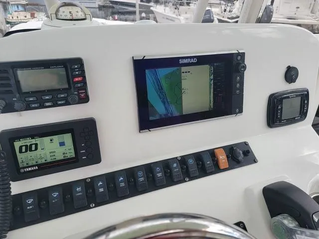 Slide: The Image of 2016 Sea Hunt Edge 24 dashboard with navigation and control systems. - 14