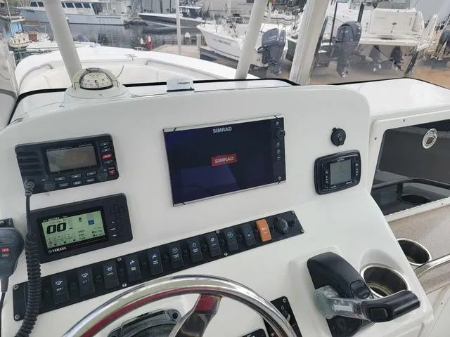 Slide: The Image of 2016 Sea Hunt Edge 24 boat dashboard with navigation and control systems. - 15