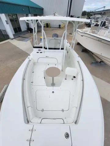 Slide: The Image of 2016 Sea Hunt Edge 24 boat with spacious deck and seating area. - 23