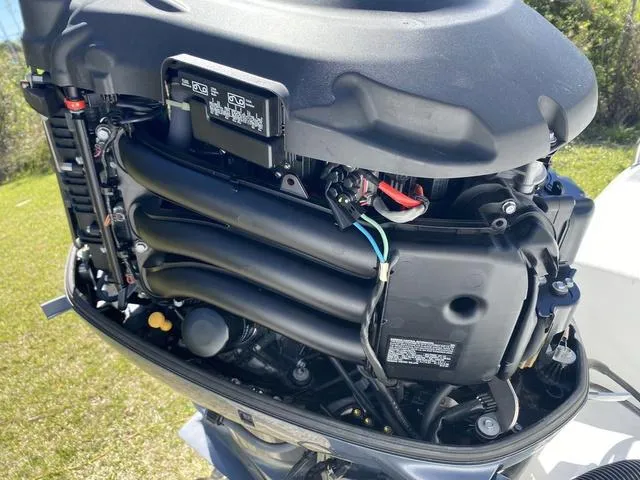 Slide: The Image of 2016 Sea Hunt Edge 24 outboard motor, detailed view of engine components. - 28