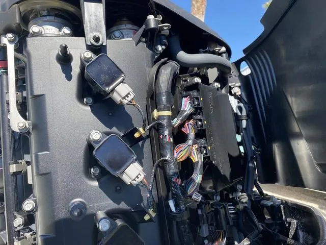 Slide: The Image of Close-up of a 2016 Sea Hunt Edge 24 engine components and wiring. - 32